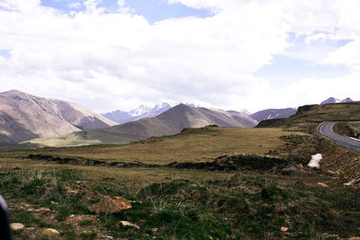 Scenic view of landscape and mountains against sky