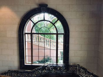 Reflection of window on glass wall at home