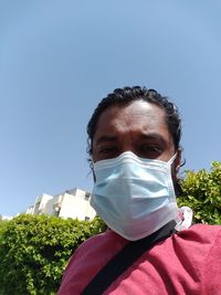 Portrait of man against clear blue sky