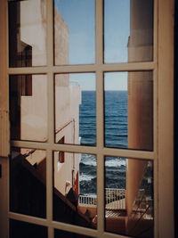 Scenic view of sea seen through window