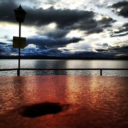 Scenic view of calm sea against cloudy sky