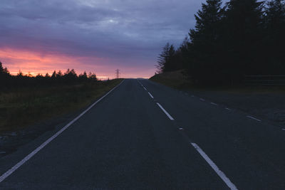 Road against sky at sunset