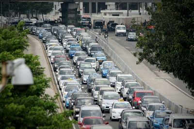 High angle view of vehicles on road in city