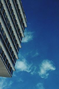 Low angle view of building against cloudy sky