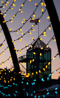 Low angle view of illuminated building at night