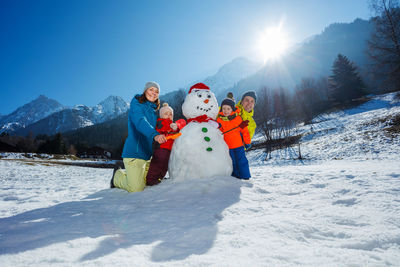 Rear view of couple on snow covered landscape