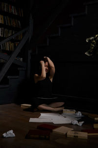 Portrait of young woman playing with toy blocks on table