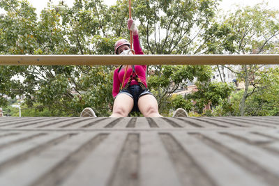 Female rappelist going down the rappel walkway. 