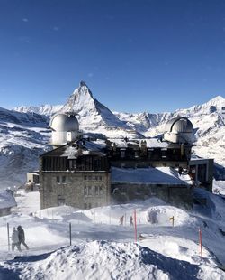 The gornergrat kulm hotel and observatory  with the matterhorn in the background. 