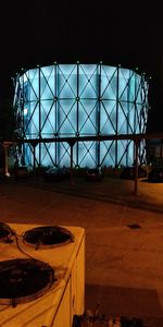 Building seen through glass window of house