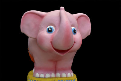 Close-up of stuffed toy against black background