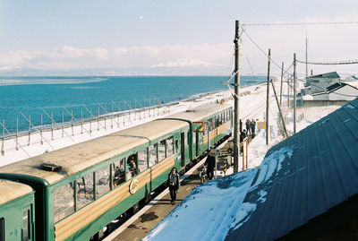 Scenic view of sea and mountains against sky