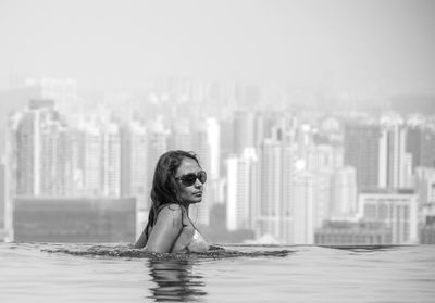 Portrait of young woman in swimming pool