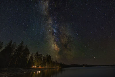 Scenic view of lake against star field at night