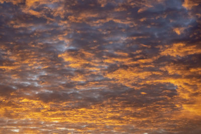 Low angle view of dramatic sky during sunset