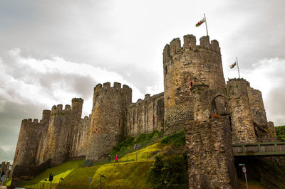 Low angle view of castle against cloudy sky