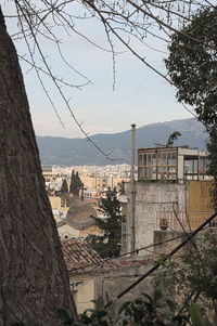 High angle view of buildings and sea against sky