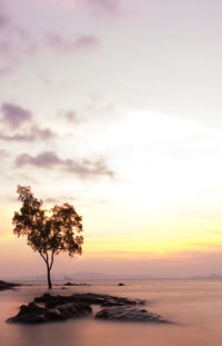 Scenic view of sea against sky at sunset
