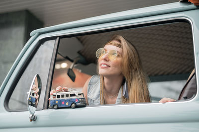 Woman sitting in van