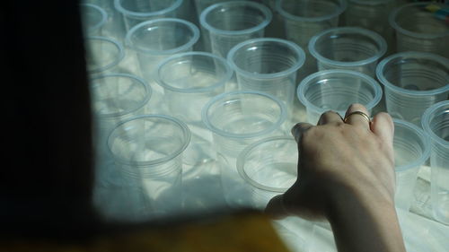 Girl arranging plastic cups