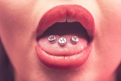 Close-up of metal alphabets in mouth