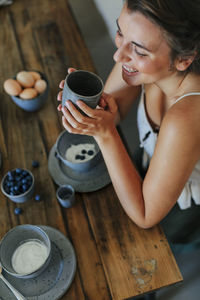 Woman at table having coffee