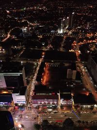 Aerial view of illuminated city at night