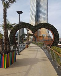 Metallic structure against sky in city