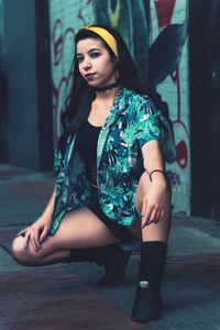 Portrait of young woman looking up