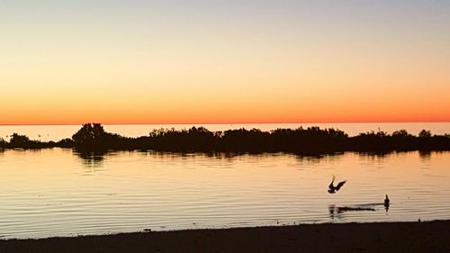 Scenic view of sea at sunset