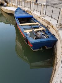 High angle view of fishing boat moored at harbor