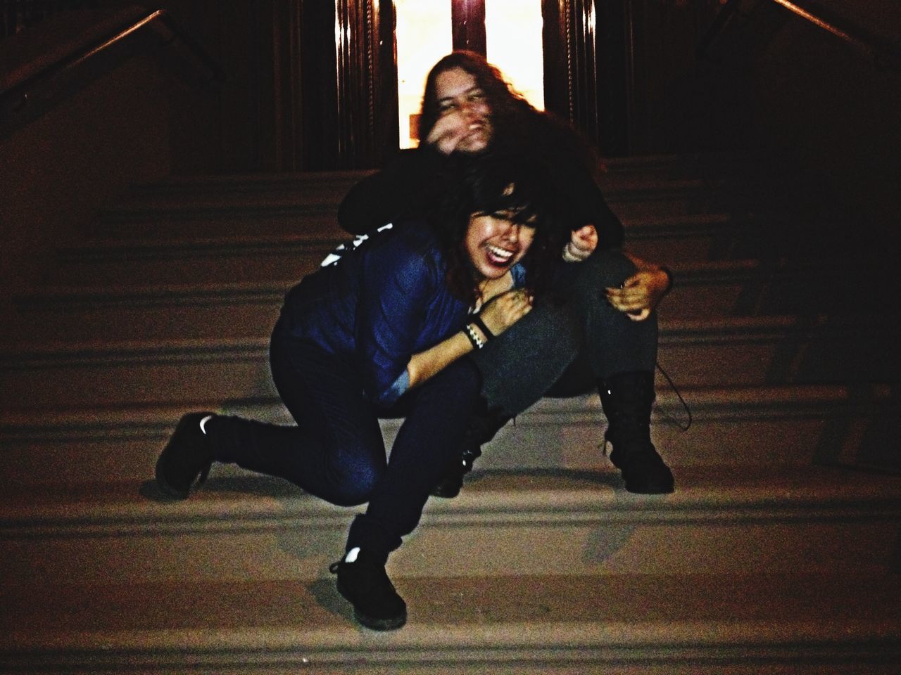 young adult, full length, lifestyles, casual clothing, person, indoors, young women, leisure activity, looking at camera, portrait, front view, standing, built structure, architecture, three quarter length, smiling, wall - building feature