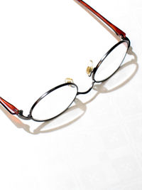 Close-up of eyeglasses against white background