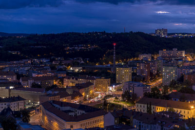 High angle view of illuminated cityscape against sky at night