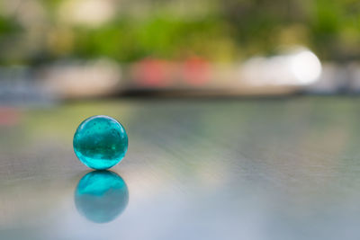 Close-up of multi colored ball on table