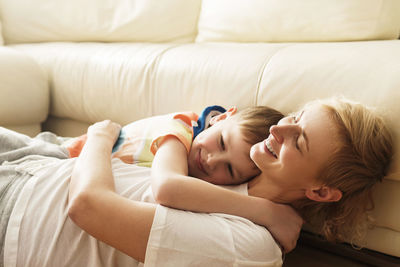 Young woman sleeping on bed at home