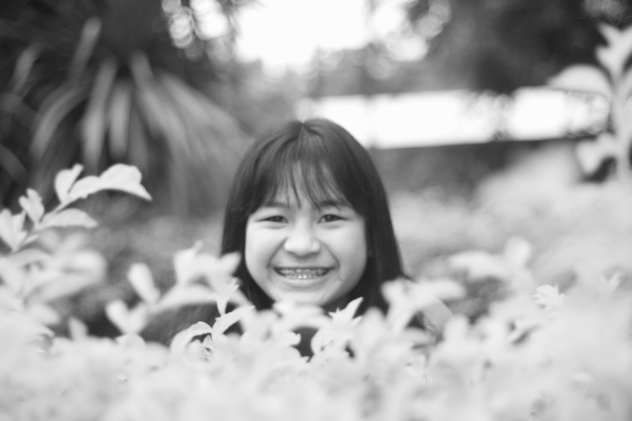 childhood, elementary age, season, leisure activity, girls, lifestyles, smiling, focus on foreground, innocence, playing, person, selective focus, front view, day, looking at camera, enjoyment, outdoors