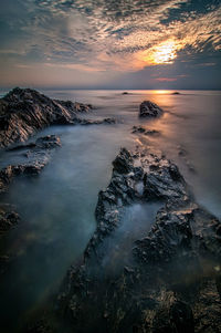 Scenic view of sea against sky during sunset