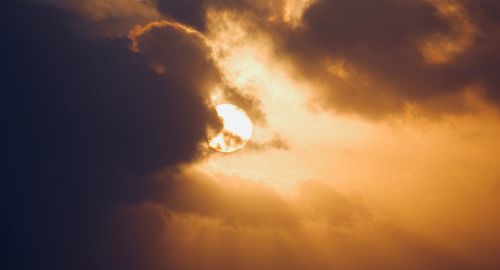 Low angle view of fire against sky during sunset