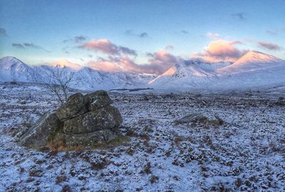 Scenic view of mountains against sky during sunset