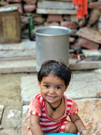 Portrait of girl by container