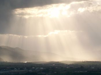 Scenic view of landscape against cloudy sky