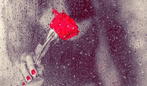 Close-up of wet glass window on rainy day