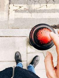 Low section of man holding ice cream