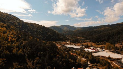 High angle view of trees and mountains against sky