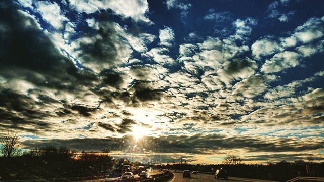 sky, cloud - sky, sun, transportation, car, cloudy, sunbeam, sunlight, cloud, land vehicle, sunset, mode of transport, nature, beauty in nature, scenics, road, tranquil scene, tranquility, lens flare, street