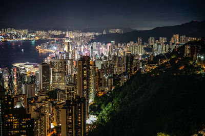High angle view of illuminated city buildings at night