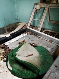 High angle view of rusty metal container in abandoned factory