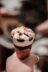 Close-up of hand holding ice cream