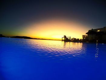 Scenic view of sea against clear sky during sunset